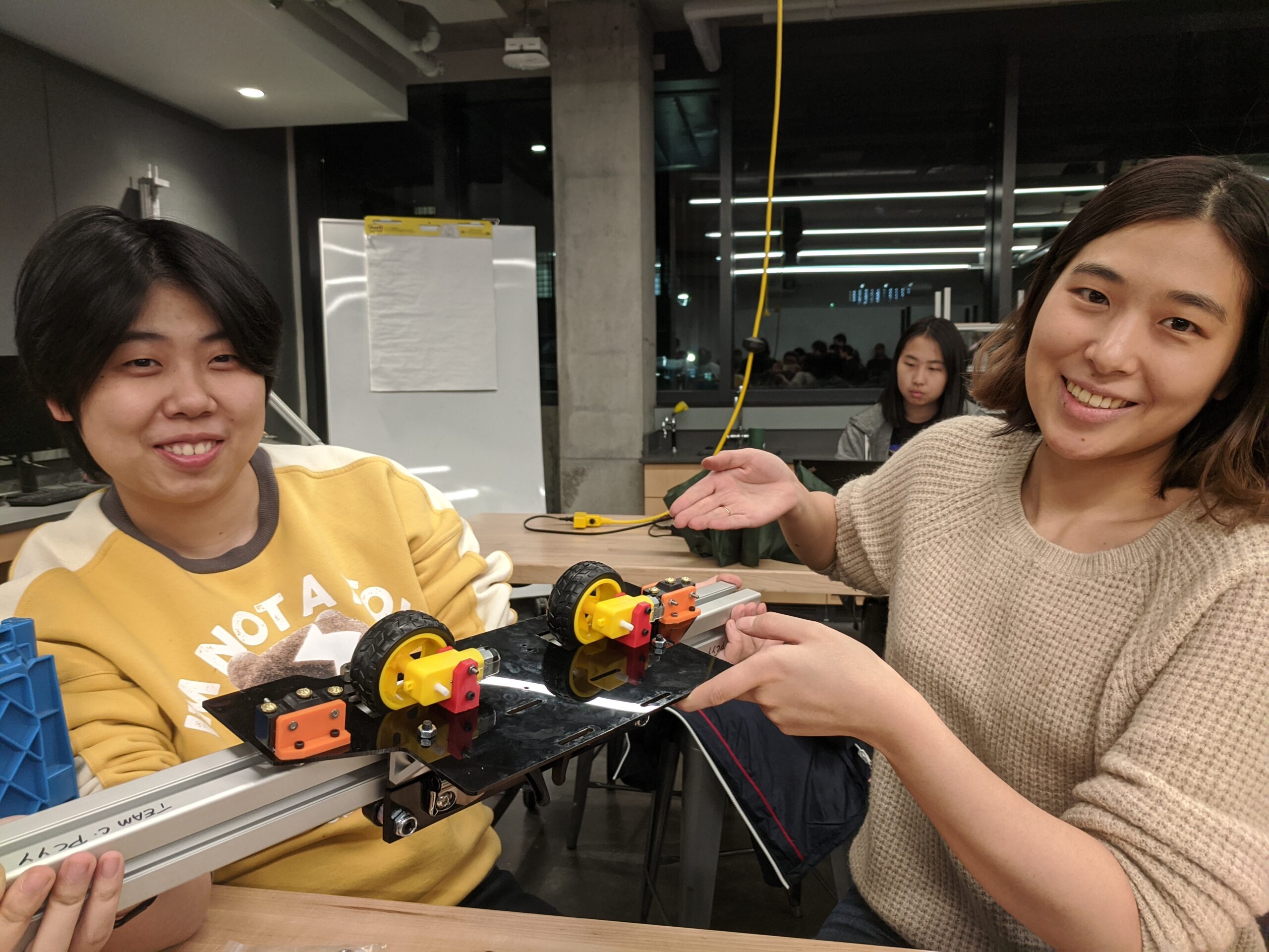 Another dream team. From left, Yingjia Hu and Yuree Chu, both in the Master's of Mechanical Engineering program. Showing the preliminary "carriage" for the window washer