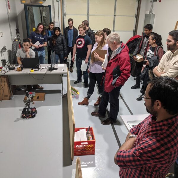 The instructors can place objects anywhere. CuBi runs autonomously, searching, finding, collecting obejcts and dumping them in the box until the whole area is clean.